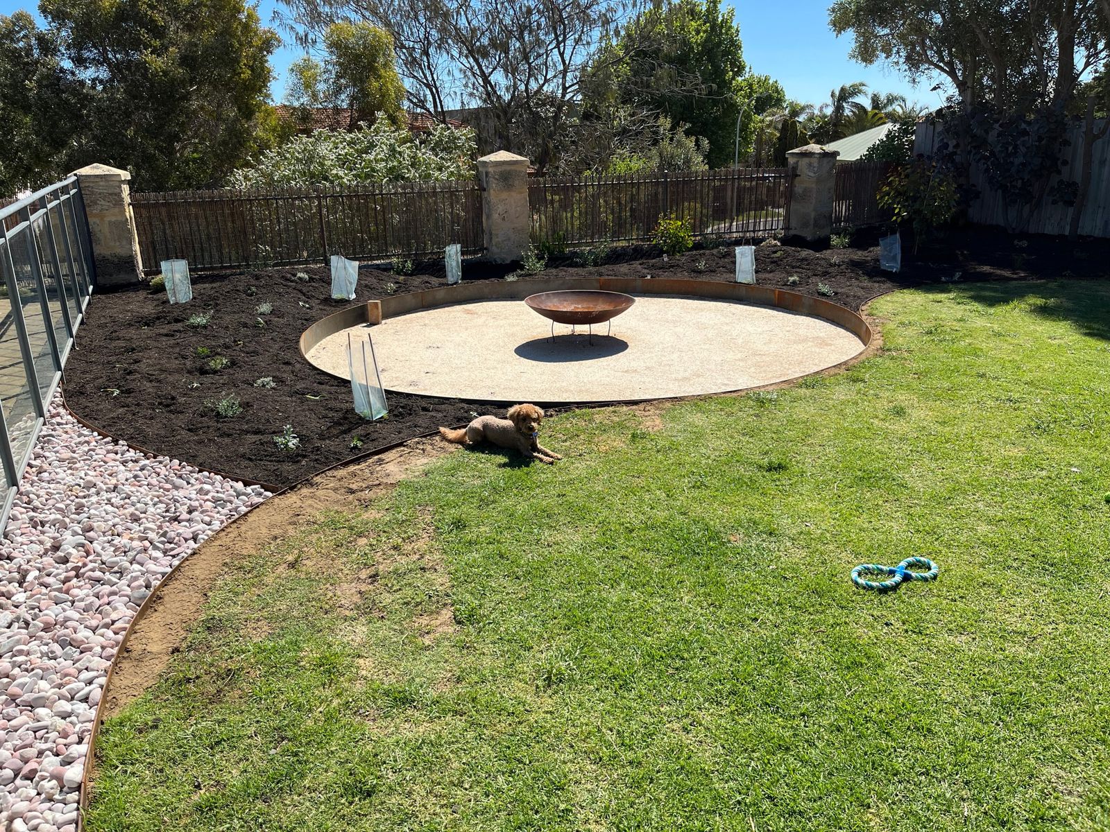 Fire pit circle and steel-edged beds
