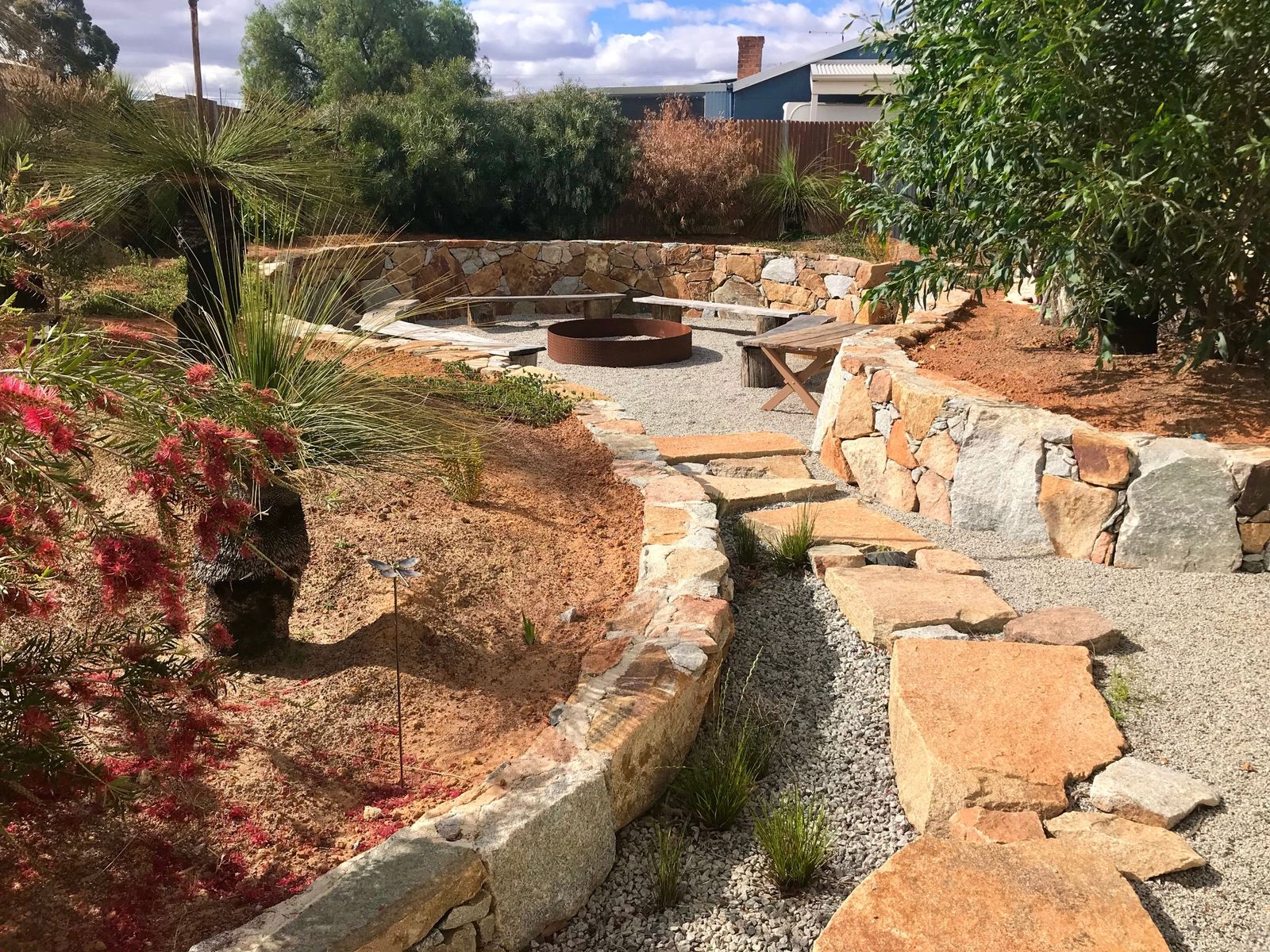 Sunken fire pit with dry-stone walls